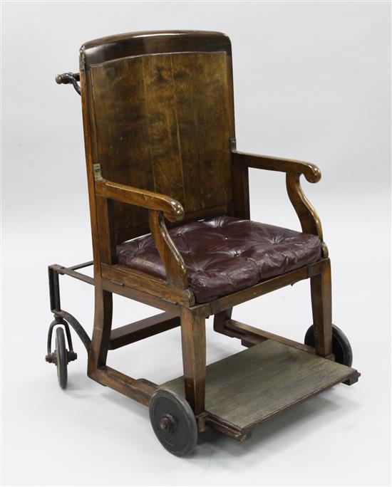 An early 20th century beech invalids chair,